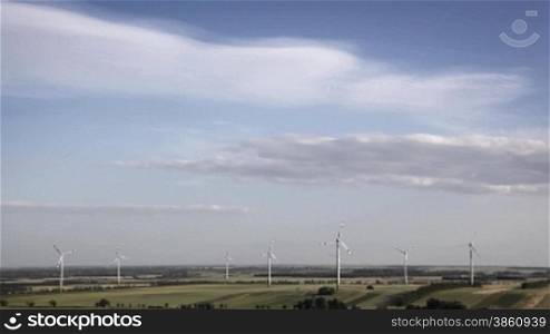 Wind energy turbines wirh wind mills in horizon