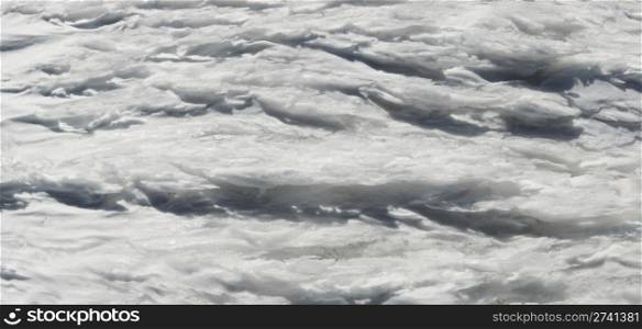 Wind form ice texture on winter mountain snow surface (five shots stitch image)