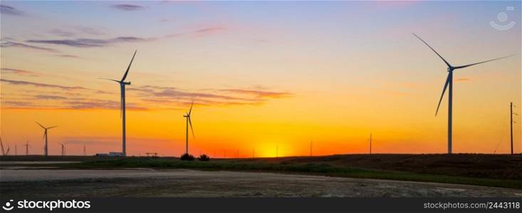 Wind generators of the ecological power plant at sunset. Wind generators of ecological power plant at sunset
