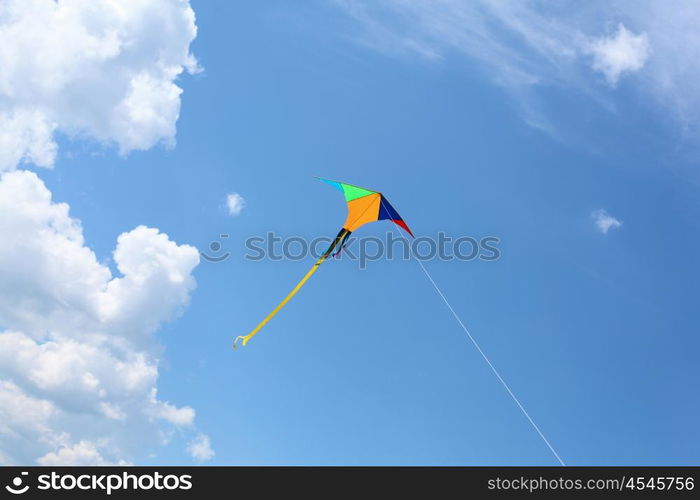 wind kite flying in the blue summer sky