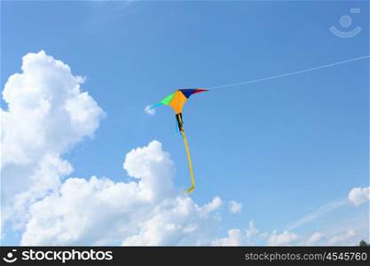 wind kite flying in the blue summer sky