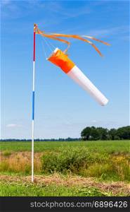 Wind meter in countryside with blue sky