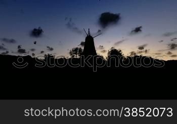 Wind Mill and timelapse clouds sunrise, tilt
