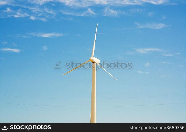 Wind mill on the bright summer day