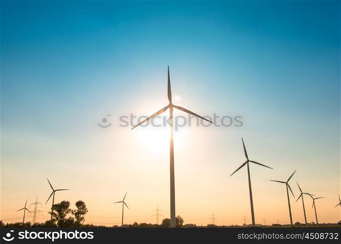 Wind mills during bright summer day