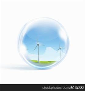 wind power. A group of wind turbines or windmills inside a glass sphere