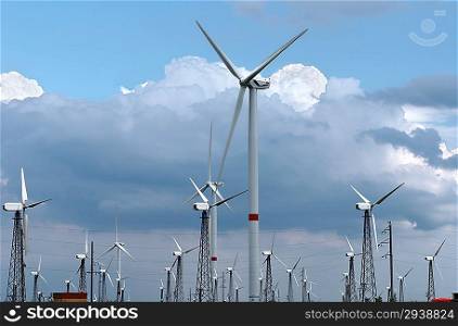 Wind-powered generators against clouds and blue sky