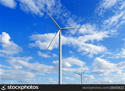 Wind-powered generators against the blue sky