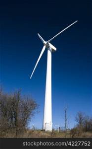 wind turbine against clear blue sky
