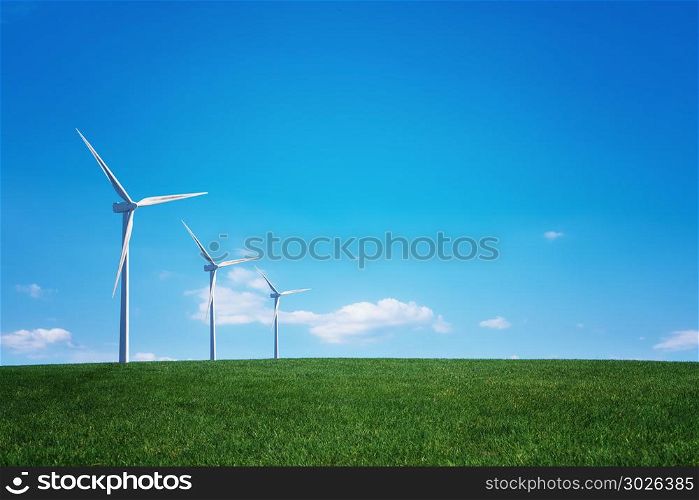 Wind turbine and green field. Wind turbine at the green grass field over blue sky