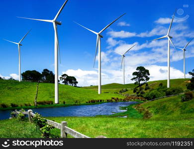 Wind turbine farm power generator in beautiful nature landscape for production of renewable green energy is friendly industry to environment. Concept of sustainable development technology.