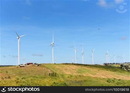 wind turbine landscape natural energy green Eco power concept at wind turbines farm blue sky background