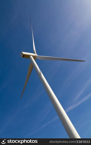Wind turbine on clear blue sky