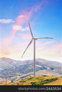 Wind turbine on hill against background of dawn sky. Element of a wind power station. Environmental Alternative Energy Concept. Wind turbine on hill against background of dawn sky