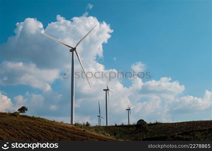 Wind turbine on mountain landscape. ecological power energy generation. Wind farm at blue sky background