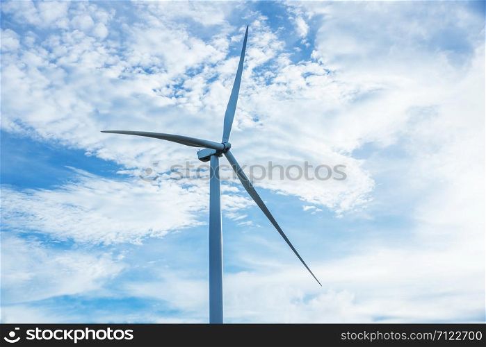 Wind turbine on the blue sky.