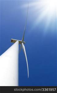 Wind turbine under clear blue sky