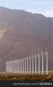 Wind turbines generate energy that goes across the mountains to LA