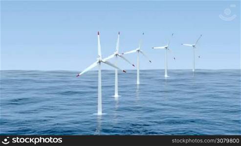 Wind turbines generating electricity in the sea