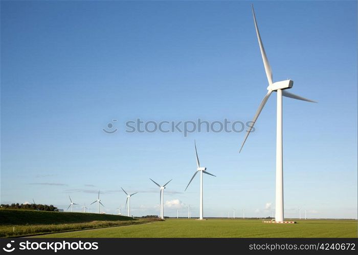 wind turbines in a row in the Dutch province of Flevoland
