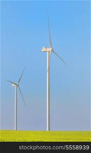 Wind turbines in spring field
