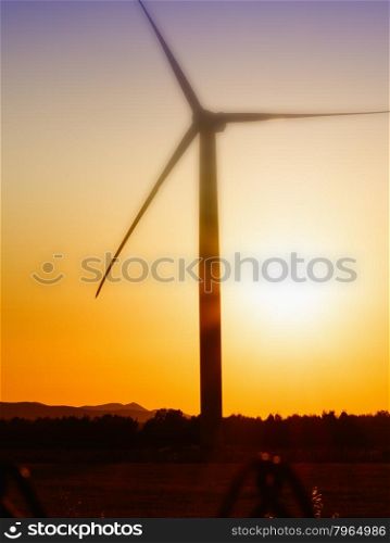 Wind Turbines in the country at sunset.