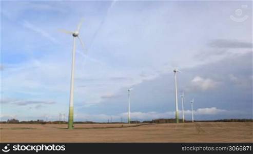 Wind turbines in the field. Time lapse.