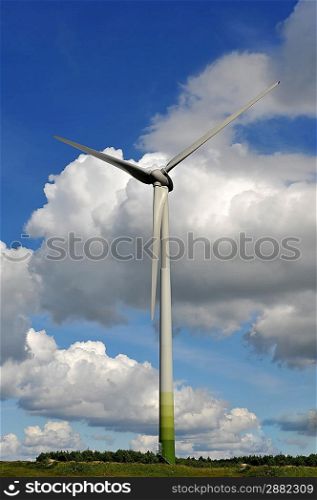 wind turbines in the fields under blue sky