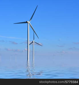 Wind turbines in the sea against a blue sky in the early morning