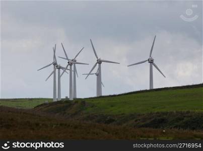 Wind turbines in wind farm on cloudy day in North Wales