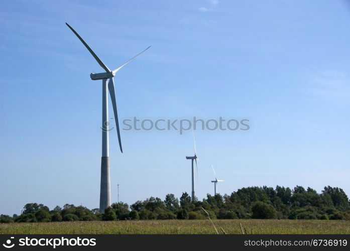 Wind turbines on a background of blue sky