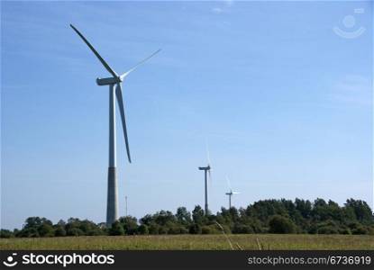 Wind turbines on a background of blue sky