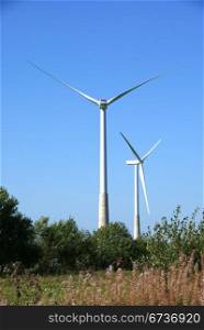 Wind turbines on a background of blue sky