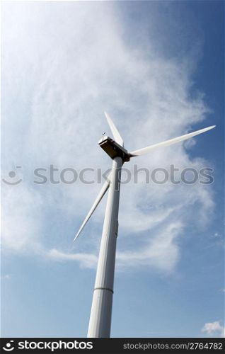 Wind turbines on hight sky.