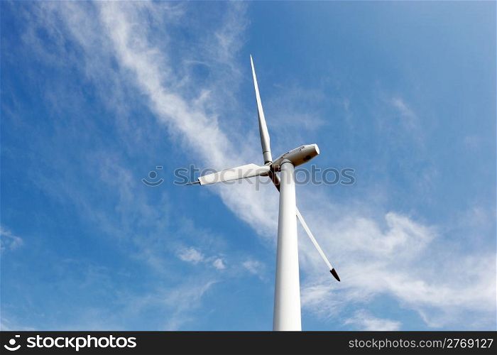Wind turbines on hight sky.