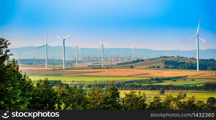 Wind turbines on the field in rural area. Ecology concept. Wind turbines on the field in rural area.