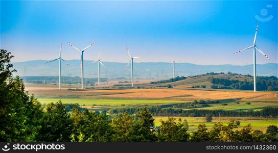 Wind turbines on the field in rural area. Ecology concept. Wind turbines on the field in rural area.