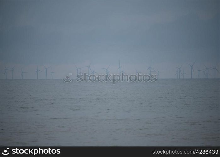 WInd turbines out at sea in Norfolk UK.