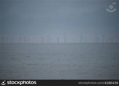 WInd turbines out at sea in Norfolk UK.