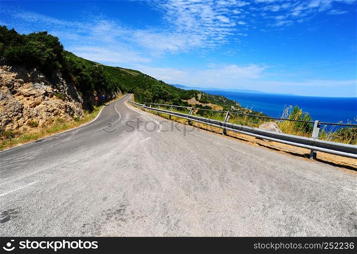 Winding asphalt road along the Italian coast. Retro style