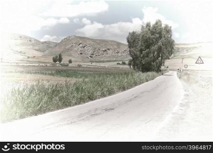 Winding Asphalt Road between Spring Fields of Sicily, Retro Image Filtered Style