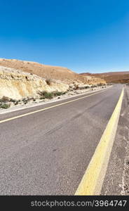 Winding Asphalt Road in the Negev Desert in Israel