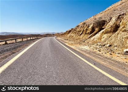 Winding Asphalt Road in the Negev Desert in Israel