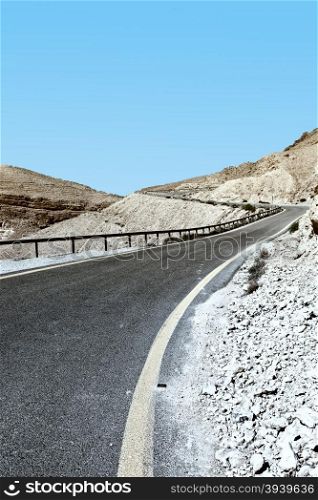 Winding Asphalt Road in the Negev Desert in Israel, Vintage Style Toned Picture