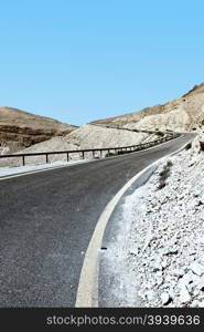 Winding Asphalt Road in the Negev Desert in Israel, Vintage Style Toned Picture