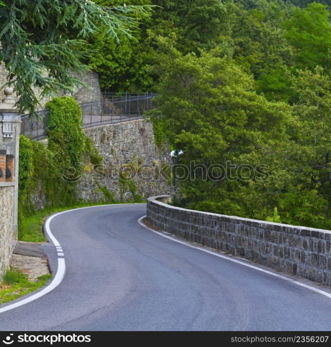  Winding asphalt road in Tuscany. Country road near the the Italian manor house
