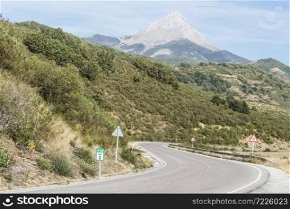 Winding asphalt road of Europe Peaks in Spain early morning