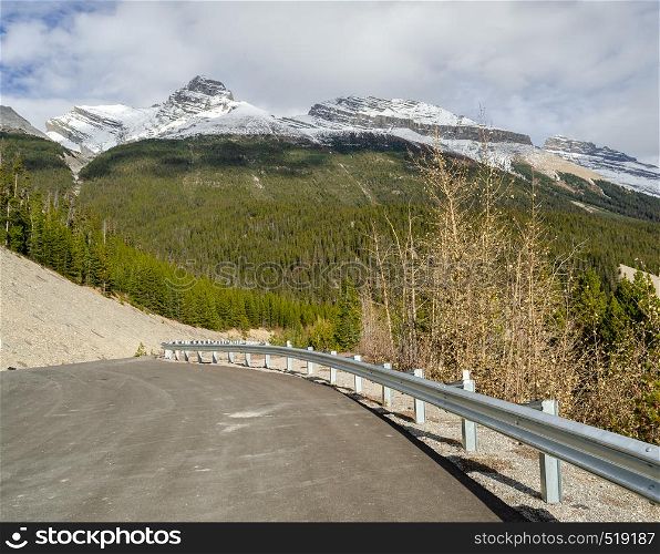 Winding Columbia icefield highway and Canadian Rockies mountains in Jasper National Park, Alberta, Canada