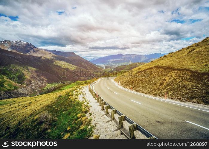 Winding empty road on the mountain with nature landscape background.