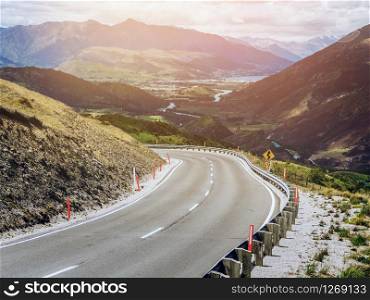 Winding empty road on the mountain with nature landscape background.